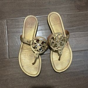 Gold miller flip flops